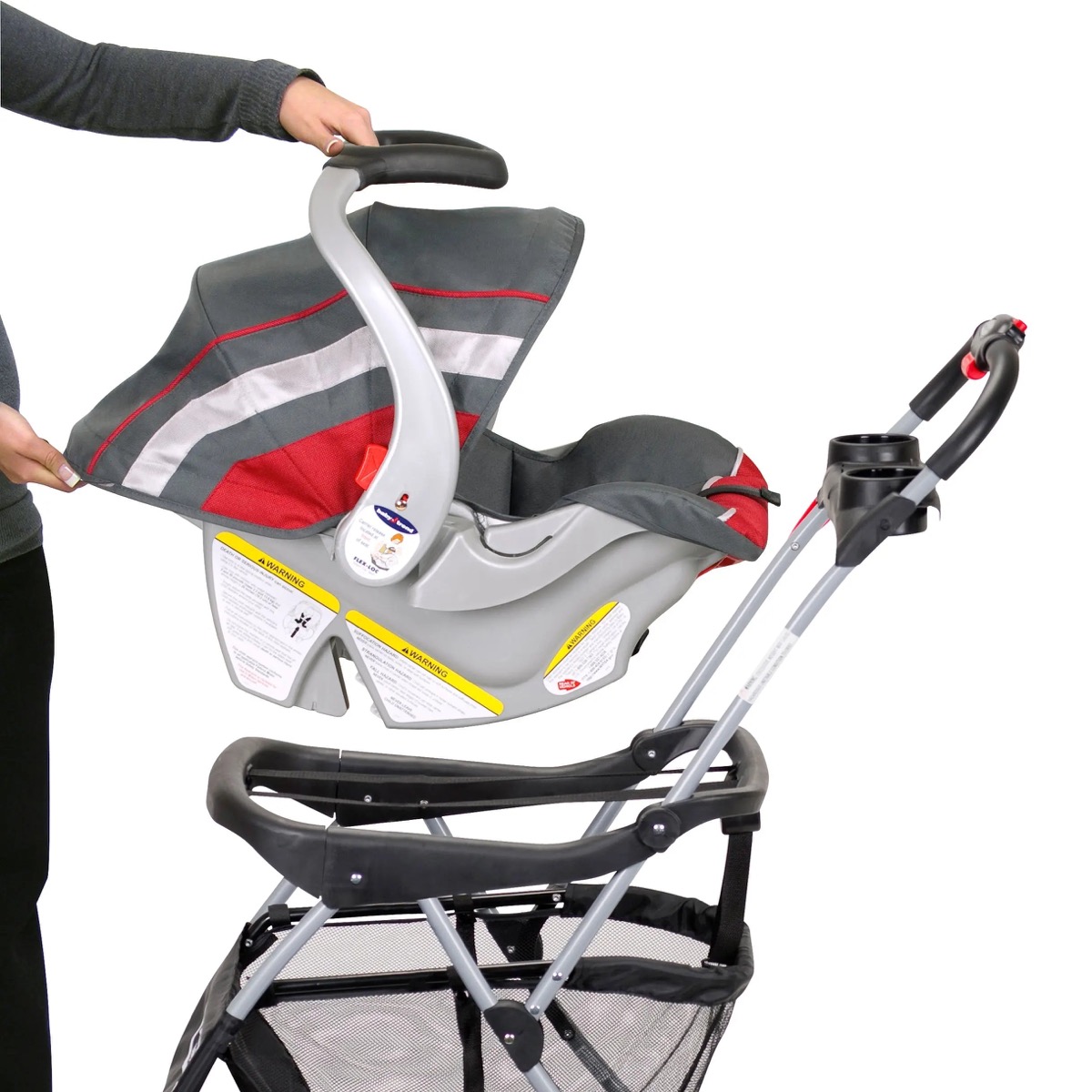 Official Baby Trend product-page detail photo of the Snap-N-Go EX Universal carrier in Black - angled view of the frame, strap attachment points, and wheels