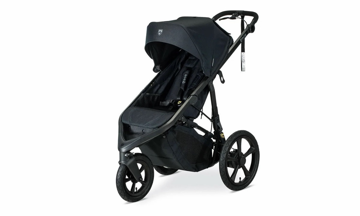 Left-side view of the Wayfinder jogging stroller in Nightfall showing the frame, independent dual suspension and spoked air-filled wheels
