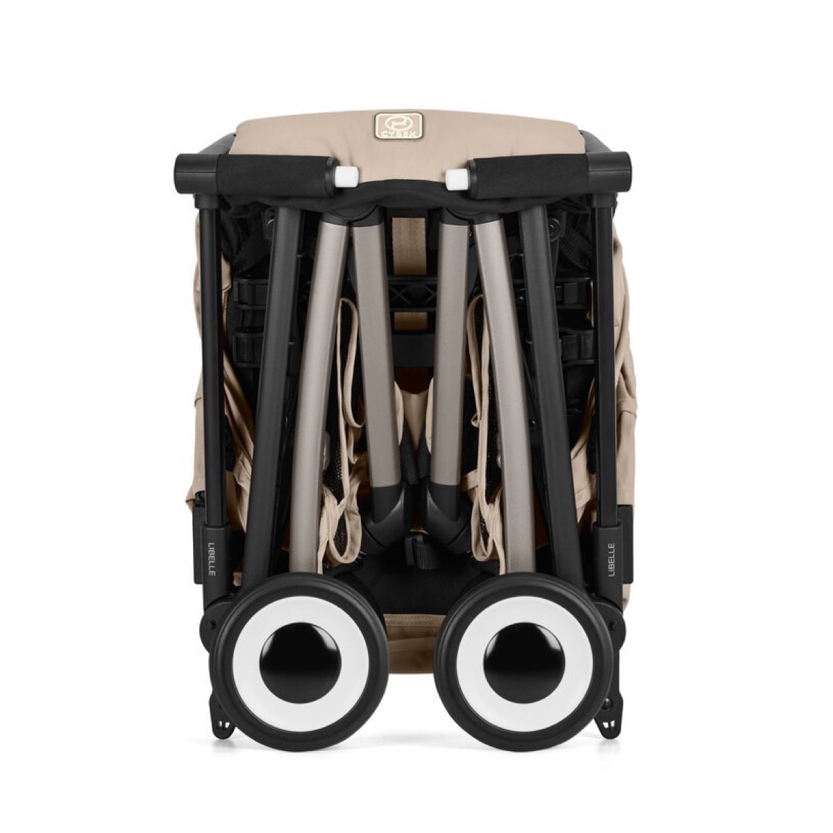 CYBEX Libelle in Almond Beige, folded and standing, rear view showing the compact frame and white-rimmed wheels